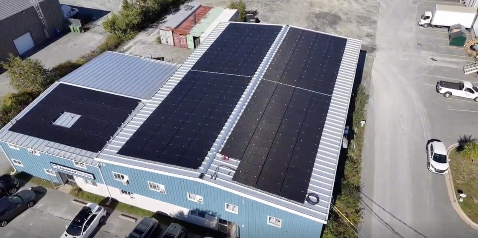 Aerial view of a large solar installation on an industrial commercial building