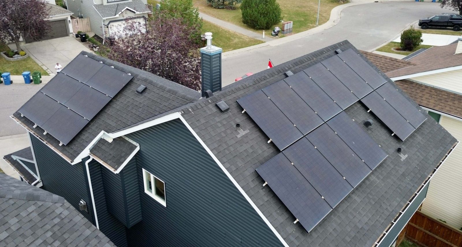 Aerial view of a home with solar panels.